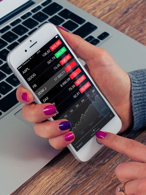 Person Checking Stock Market on Mobile